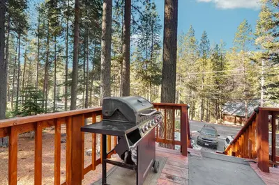 a grill on the deck of a house at Sierra Nevada Serenity in South Lake Tahoe
