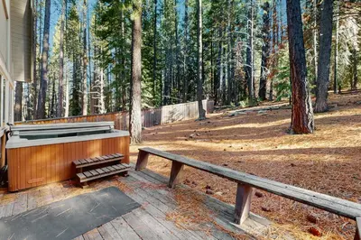 a piano sitting on a deck next to a bench at Sierra Nevada Serenity in South Lake Tahoe