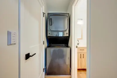 a television sitting on top of a refrigerator in a hallway at Incline Village Stunner in Incline Village
