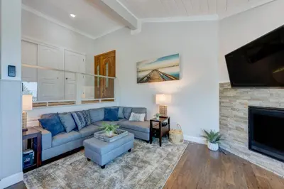 a living room with a blue couch and a fireplace at Casa Azul in Incline Village
