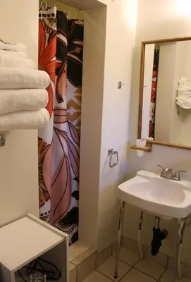 a bathroom with a sink and a mirror at The Bonnie Inn Unit 6 in San Andreas