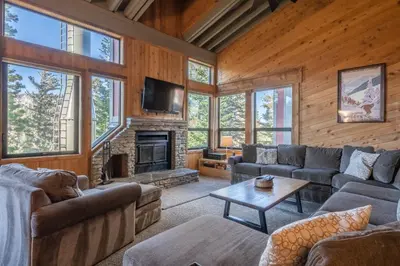 a living room with couches and a fireplace at Updated 5 Bedroom 3 bathroom townhome Slopeside at 1849 Condos 671 sleeps 10 in Mammoth Lakes
