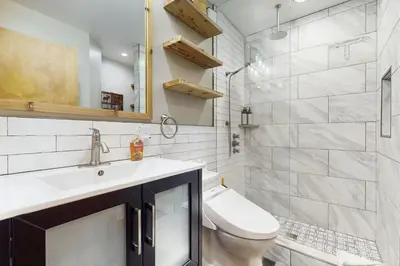 a bathroom with a sink and a toilet and a shower at Coyote Fork Escape in Truckee