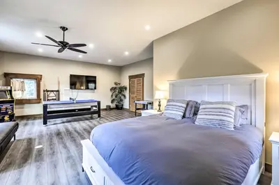 a bedroom with a large bed with a ceiling fan at 6 Mi to Homewood Mountain Resort Tahoe City Gem! in Tahoe City
