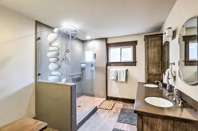 a bathroom with a shower and two sinks and a shower at 6 Mi to Homewood Mountain Resort Tahoe City Gem! in Tahoe City