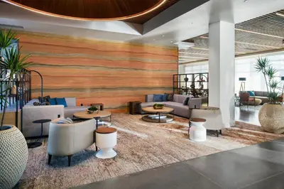 a lobby with couches and tables and chairs at Element Reno Experience District in Reno