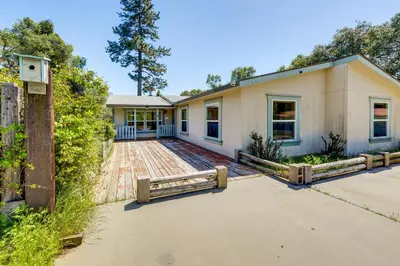 a house with a fence in front of it at 33 Mi to Yosemite Secluded Mariposa Retreat! in Mariposa
