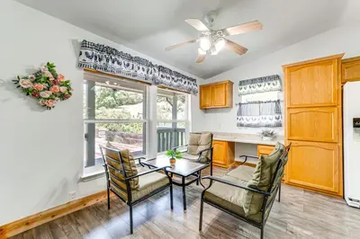 a living room with a table and chairs and a kitchen at 33 Mi to Yosemite Secluded Mariposa Retreat! in Mariposa