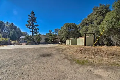 an empty parking lot in front of a building at 33 Mi to Yosemite Secluded Mariposa Retreat! in Mariposa