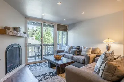 a living room with two couches and a fireplace at Highly updated 1 Bedroom plus den, 2 bath Crestview Unit 5 Sleeps up to 4 located near Canyon Lodge in Mammoth Lakes