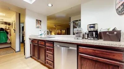 a kitchen with a counter top with a coffee maker at Aspen Creek #115 condo in Mammoth Lakes