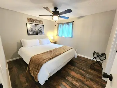 a bedroom with a bed and a ceiling fan at Miners Suite-Centrally Located in Shaver Lake in Shaver Lake
