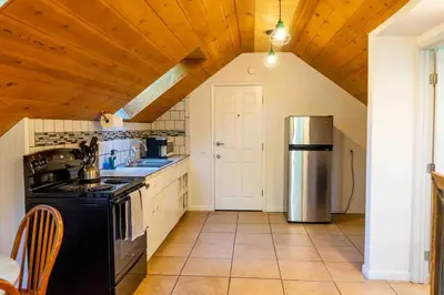 a kitchen with a stove and a refrigerator at Hawks Nest- Perfect Getaway in Shaver Lake in Shaver Lake