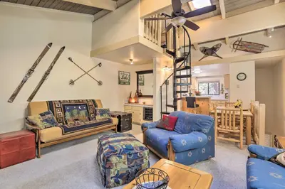 a living room with a blue couch and chairs at 1 Mi to Diamond Peak Skiing Incline Village Condo in Incline Village