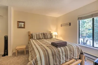 a bedroom with a bed and a window at 1 Mi to Diamond Peak Skiing Incline Village Condo in Incline Village