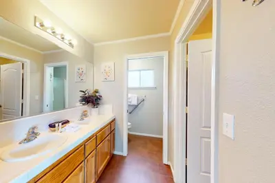 a bathroom with two sinks and a large mirror at Five Oaks Circle Ranch in Oakhurst
