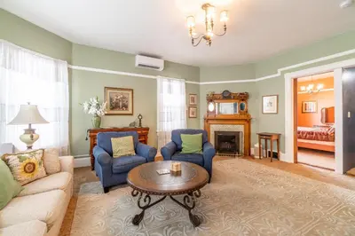 a living room with a couch and chairs and a table at Rustic 2-Bedroom walking distance to Downtown in Reno