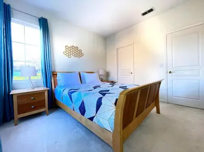 a bedroom with a large bed and a window at King Bed Quiet Home on Cul-de-Sac Hiking Trails in Roseville