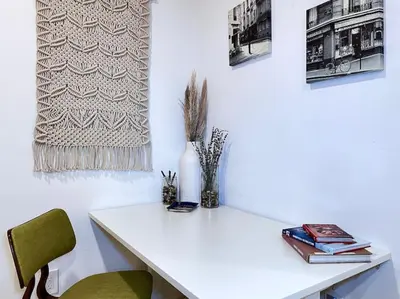 a white desk with two chairs and a vase on it at King Bed-Private Yard-Driveway Parking in Sacramento