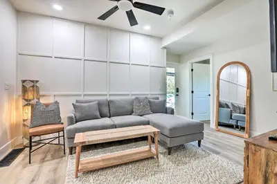 a living room with a couch and a table at Boho-Chic Folsom Retreat Walkable Location! in Folsom