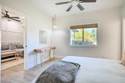 a bedroom with a bed and a ceiling fan at Boho-Chic Folsom Retreat Walkable Location! in Folsom