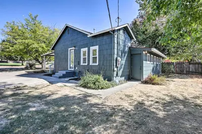 a blue house with a garage in a yard at Boho-Chic Folsom Retreat Walkable Location! in Folsom