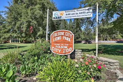 a sign for a foshan cityinois fair in a park at Boho-Chic Folsom Retreat Walkable Location! in Folsom