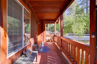 a porch of a house with a bench on it at Near Hikes Arnold Cabin with EV Charger and Fire Pit in Arnold
