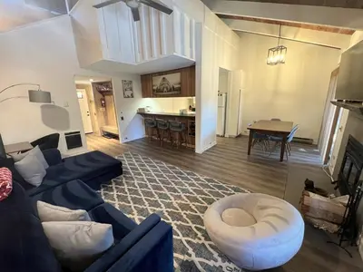 a living room with a couch and a table at 118 Standard home in Mammoth Lakes