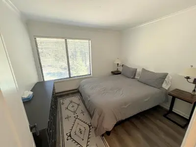 a small bedroom with a bed and a window at 118 Standard home in Mammoth Lakes