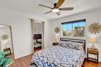 a bedroom with a bed and a ceiling fan at Villa near Yosemite & bass lake w/Hot Tub/EVcharge in Oakhurst