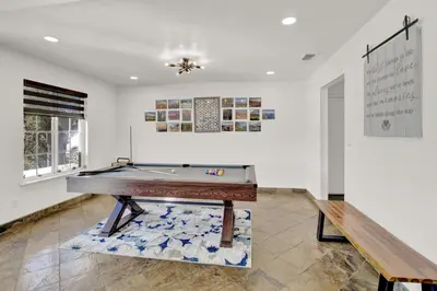 a pool table in a room with a wall at Villa near Yosemite & bass lake w/Hot Tub/EVcharge in Oakhurst