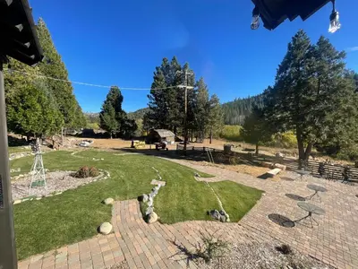 a view of a park with grass and trees at Sierra Woods Lodge in Emigrant Gap
