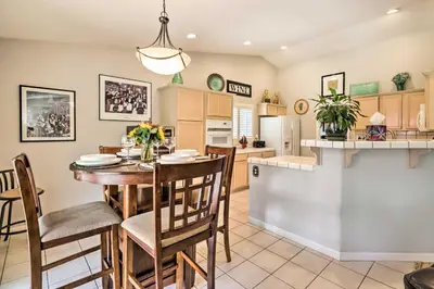 a kitchen and dining room with a table and chairs at Hot Tub and Fire Pit Reno Gem 12 Mi to Skiing in Reno