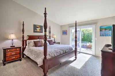 a bedroom with a large bed and a window at Hot Tub and Fire Pit Reno Gem 12 Mi to Skiing in Reno