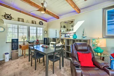 a living room with a dining room table and chairs at Bethel Island Retreat with Private Boat Slip! in Bethel Island