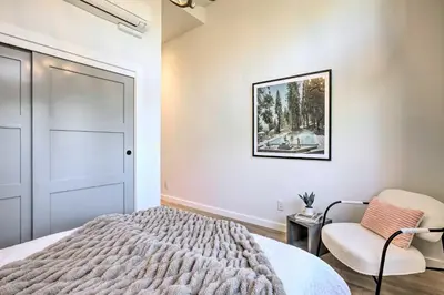 a bedroom with a bed and a chair at Hot Tub! Family Home 7 Mi to Diamond Peak Resort in Kings Beach