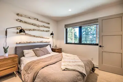 a bedroom with a bed and a window at Hot Tub! Family Home 7 Mi to Diamond Peak Resort in Kings Beach