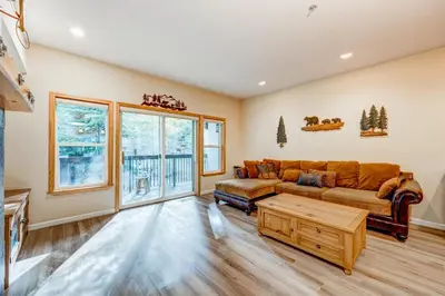 a living room with a couch and a table at Tavern Inn #39 in Olympic Valley