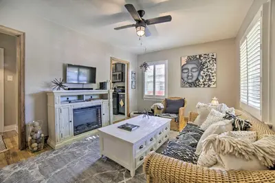 a living room with a couch and a fireplace at Hot Tub and Walk to Midtown! Reno Retreat in Reno