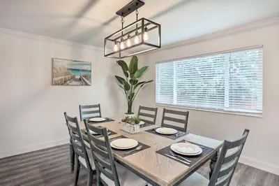 a dining room with a table and chairs at Relax Fireside and Play Pool! Home 4 Mi to Dtwn Reno in Reno