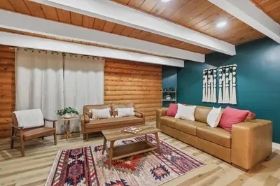 a living room with a couch and a table at Tahoe Mountain Inn in South Lake Tahoe