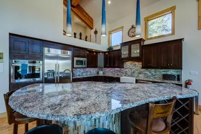 a large kitchen with a large marble counter top at Sierra Vista in Truckee