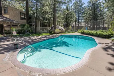 a swimming pool with a hose in a yard at Horizons IV 180 New Luxurious Listing Fully Remodeled 2 Bedrm Plus Loft 2 and a half Bathrm Sleeps 8 in Mammoth Lakes
