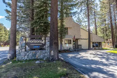 a sign in front of a building with trees at Horizons IV 180 New Luxurious Listing Fully Remodeled 2 Bedrm Plus Loft 2 and a half Bathrm Sleeps 8 in Mammoth Lakes