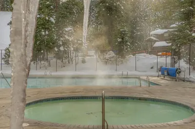 a swimming pool in a park with snow on it at Granlibakken Getaway - #72A in Tahoe City