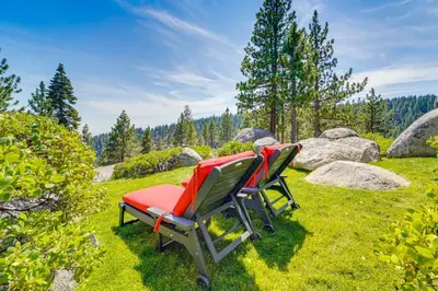 two chairs sitting in the grass in a field at 4 Mi to Slopes! Hot Tub Haven with Lake Tahoe Views in Incline Village