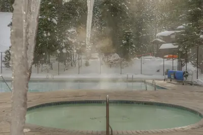 a swimming pool with a fountain in the snow at Granlibakken Gem - Unit 71 in Tahoe City