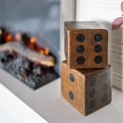 two wooden dice sitting on a counter next to a fireplace at Panorama Place in Reno