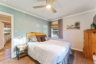 a bedroom with a bed and a ceiling fan at Reno Roost in Reno